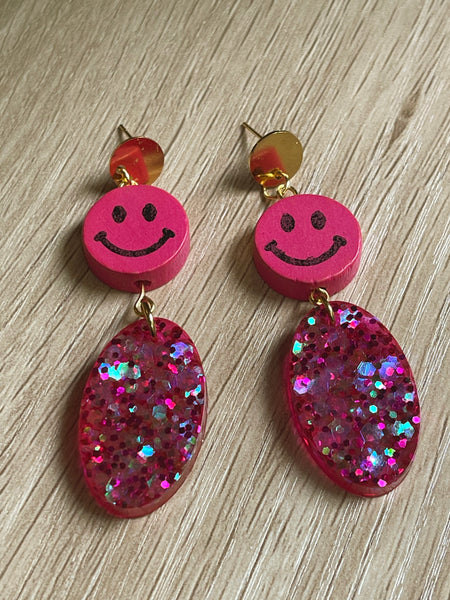 Pink glitter and smiley face earrings