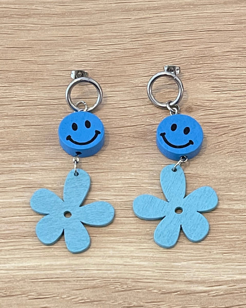Blue daisy and smiley face earrings